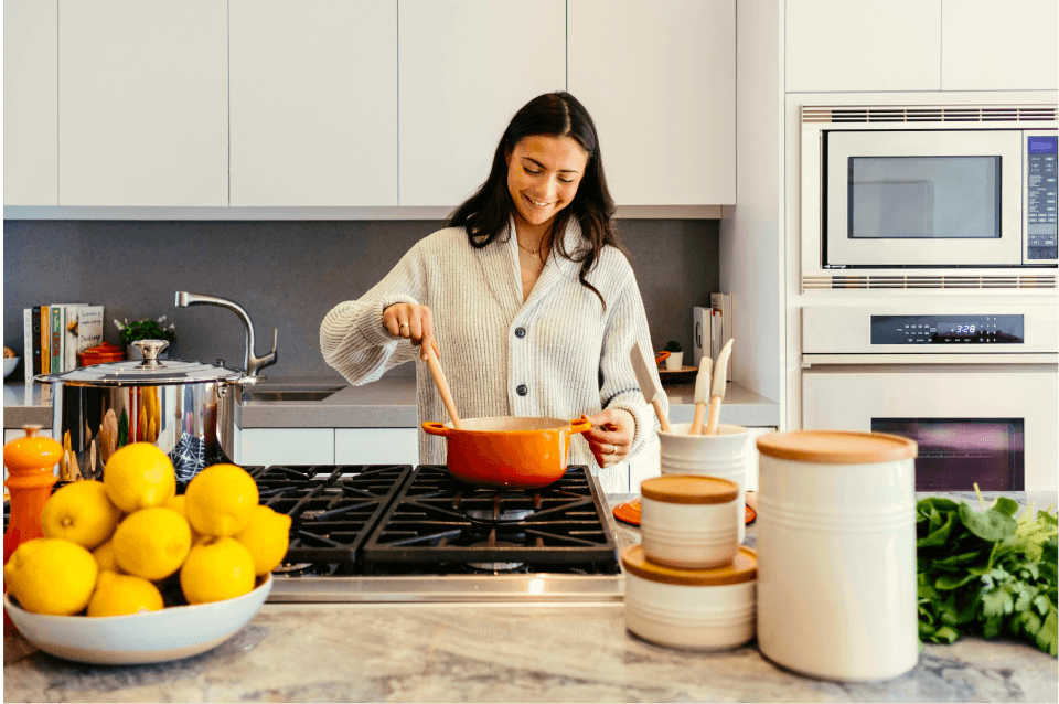 A young woman is enjoying her non-toxic sustainable kitchen